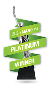 A silver MarCom trophy with a green "2025 MarCom Platinum Winner" ribbon for digital marketing agency excellence.