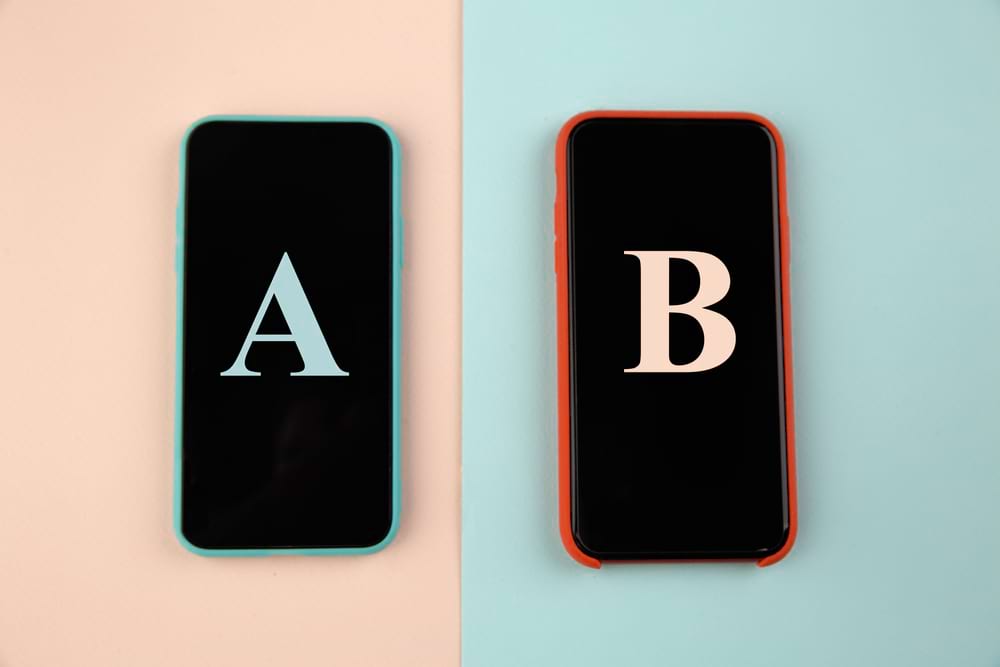 Two smartphones show A/B testing graphics, ideal for digital marketing agencies.