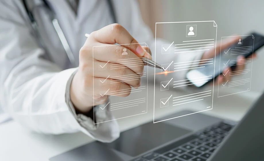 A marketer reviews digital checklists on a laptop for SEO and content marketing tasks.