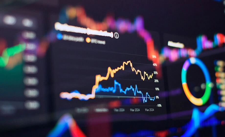 A monitor shows SEO, content marketing, and paid media graphs for agencies.