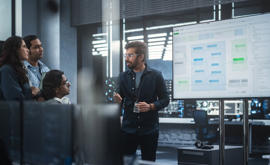A digital marketing agency team reviews SEO, content, and social media strategy charts.