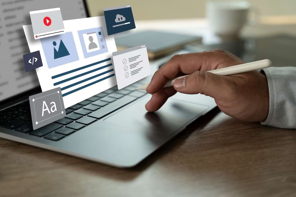 A marketer uses a laptop with icons for SEO, content marketing, and web development.