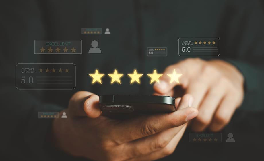 A person reviews five-star ratings on a smartphone for digital marketing services.