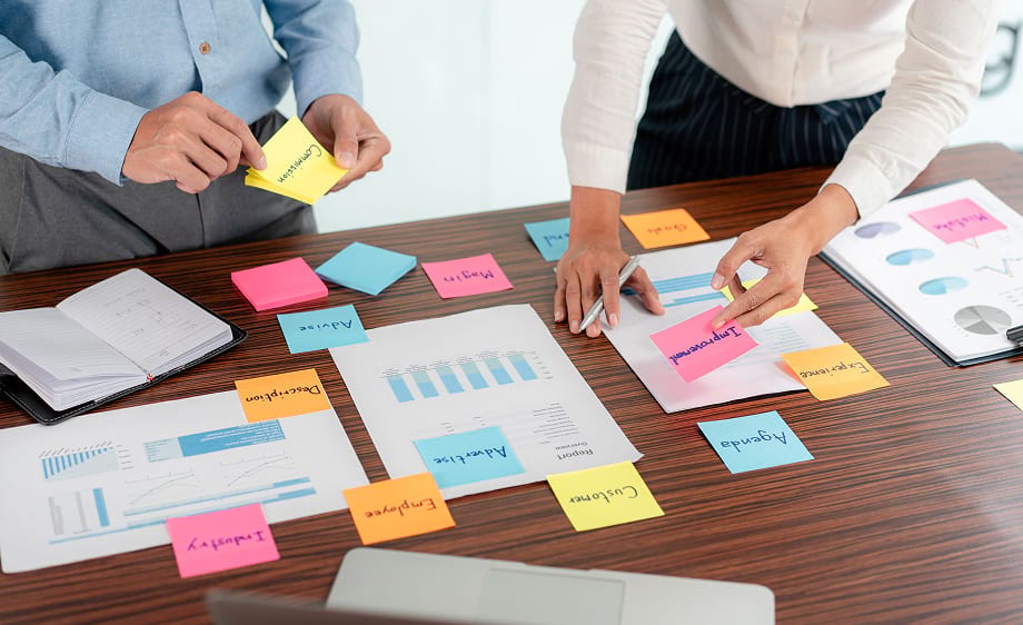 Digital marketing agency team reviews SEO, content marketing, and analytics charts.