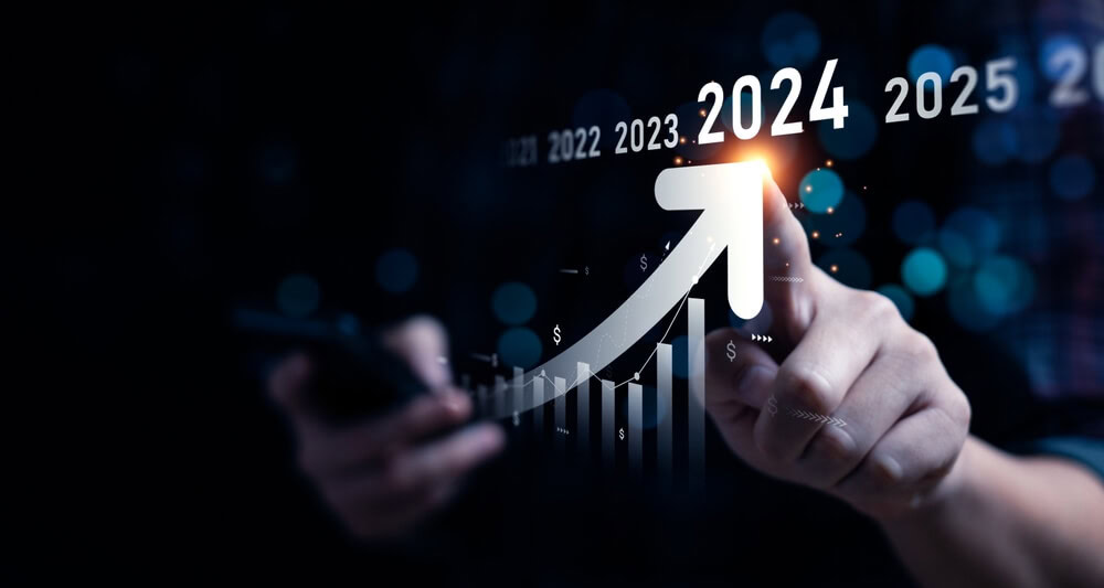 A marketer points to 2024 growth with graphs, phone, SEO services, and paid media.
