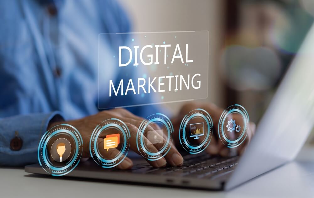 Person typing on laptop with SEO, content marketing, and web development icons.