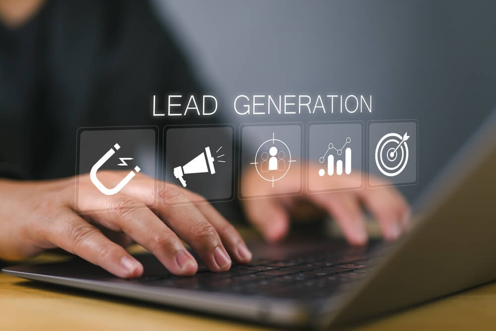 Hands typing on laptop with digital marketing, SEO, and lead generation icons.