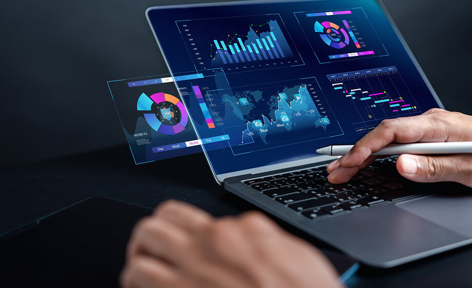 A person uses a stylus on a laptop with SEO and content marketing dashboards.
