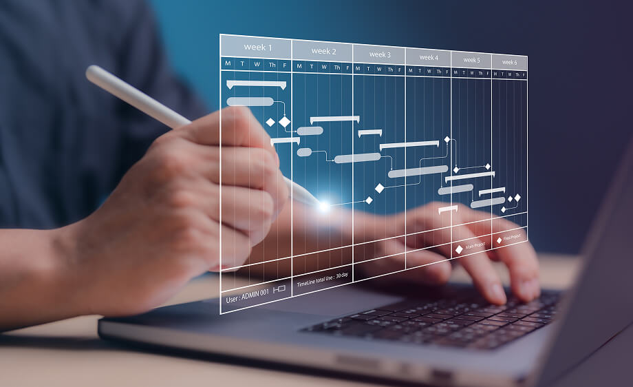 A marketer uses a stylus on a digital Gantt chart for SEO and content marketing.