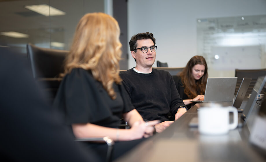 Digital marketing agency team discusses SEO, social media marketing, and content.