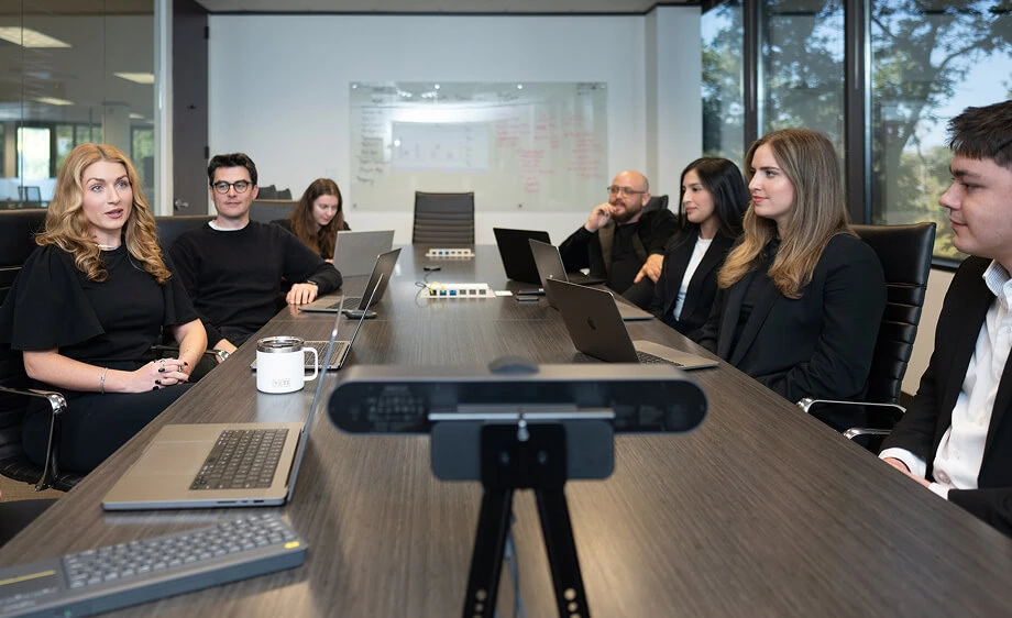 Digital marketing agency team discusses SEO, paid media, and content strategy.