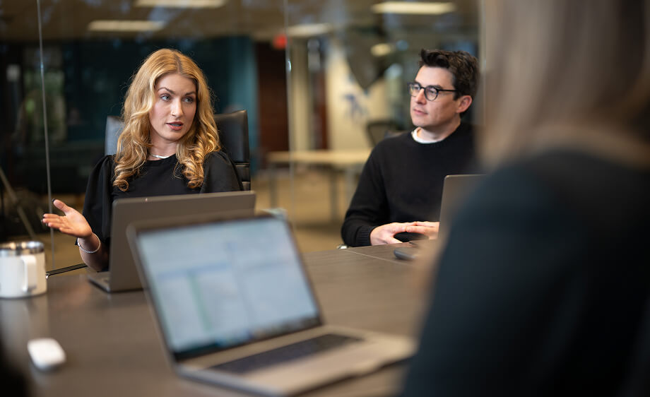 Digital marketing agency team discusses SEO, content, and social media strategies.