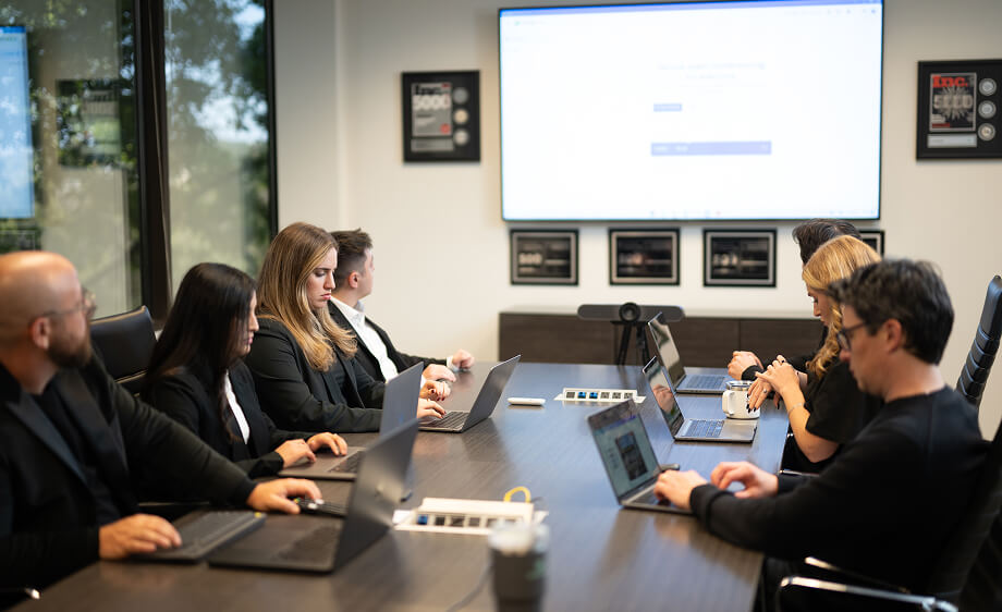 Digital marketing agency team reviews content marketing and SEO strategy presentation.