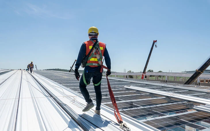 A construction worker on a roof symbolizes SEO services and web development expertise.