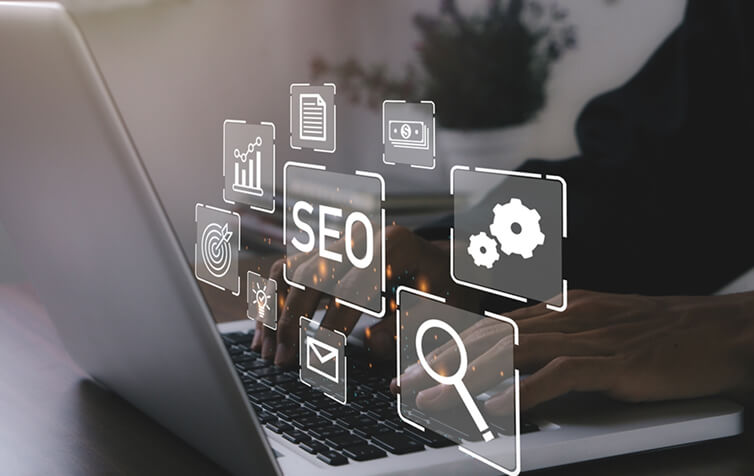 Person typing on laptop with SEO and digital marketing icons, representing SEO services, content marketing, and social media strategies.