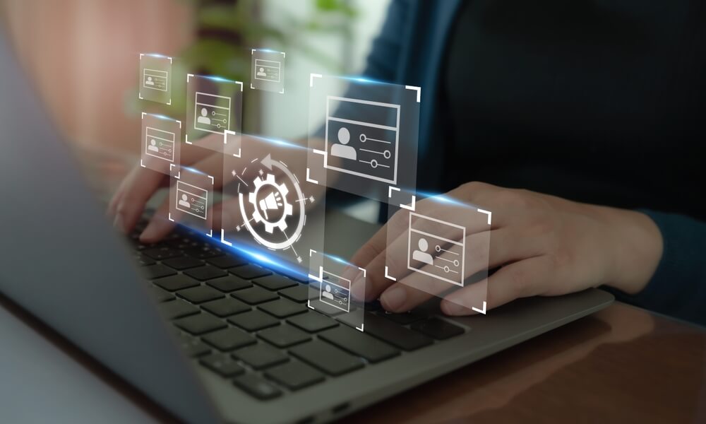 Digital marketing agency professional typing on laptop with SEO and social media icons.