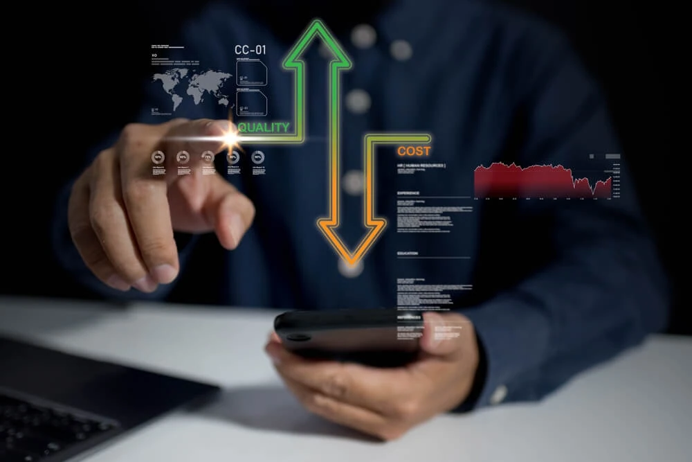 A marketer uses a smartphone with Shape SEM virtual graphics showing SEO quality vs. cost analytics.