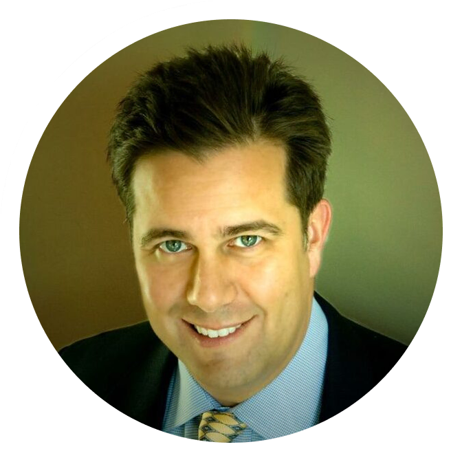 Dr. Jonathan Calure, digital marketing expert, smiles in a professional agency headshot.