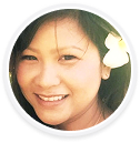 A woman smiling at the camera, representing a digital marketing agency brand.