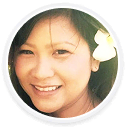A woman smiling at the camera, representing a digital marketing agency brand.