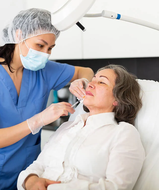 A healthcare worker gives an injection, ideal image for a digital marketing agency's SEO or social media strategy.
