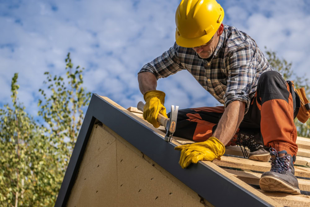 Construction working working on a roof for a client that was acquired with the help of a Digital marketing agency.